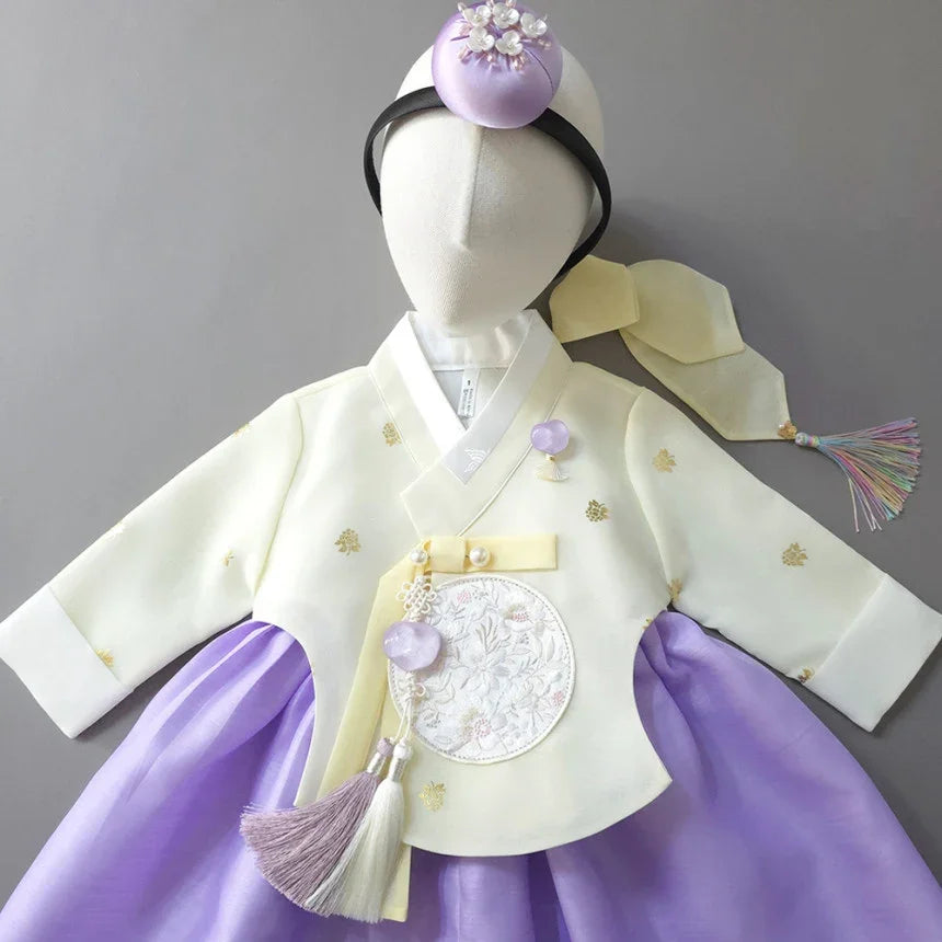 Girl Hanbok by Native Korean featuring a pale yellow jeogori, purple chima, and jokduri.