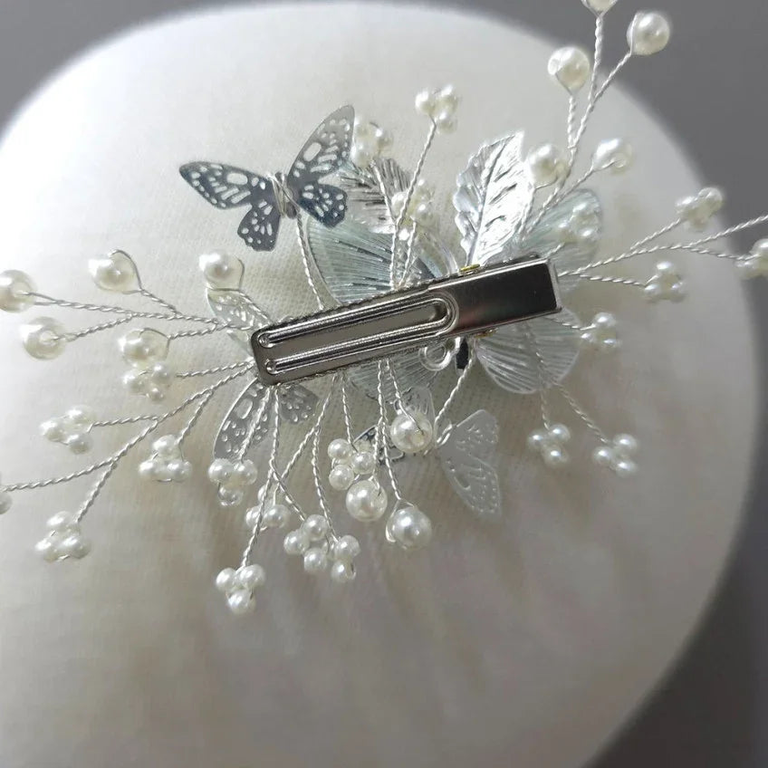 Back view of a Native Korean Sana butterfly hairpin with silver leaf and pearl accents