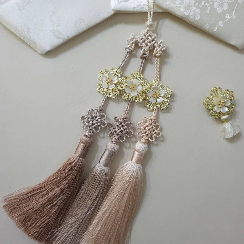 A Native Korean Bloom Tassel Norigae with floral embellishments and silk tassels.