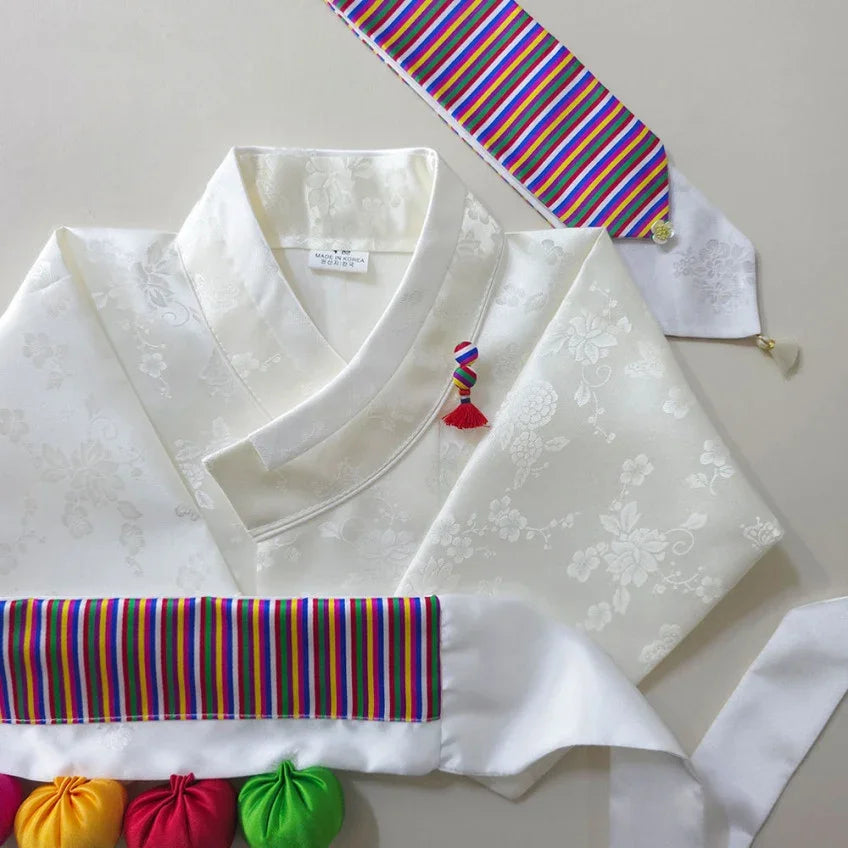White Native Korean hanbok with colorful saekdong accents and a small norigae