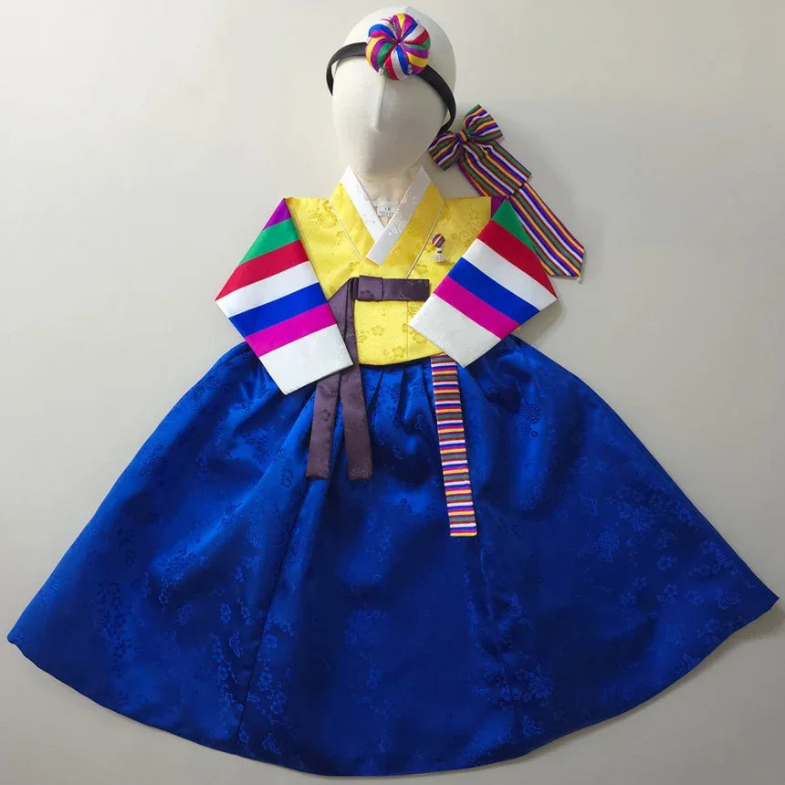 Native Korean Girl Hanbok featuring a yellow saekdong jeogori and a blue skirt.