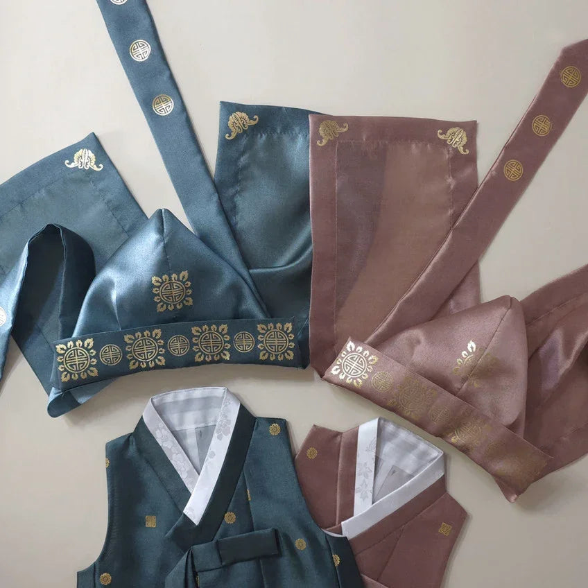 Native Korean Dowon Bokgun in blue and dusty rose colors with gold traditional patterns.