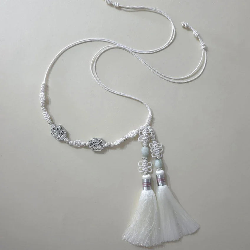 White Native Korean Bamboo Tassel Dol Belt with traditional knots and silver ornaments