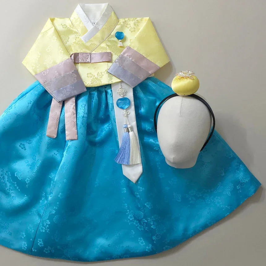 Yunjae Sky Skirt Girl Hanbok by Native Korean with a Jokduri and Norigae accessory.