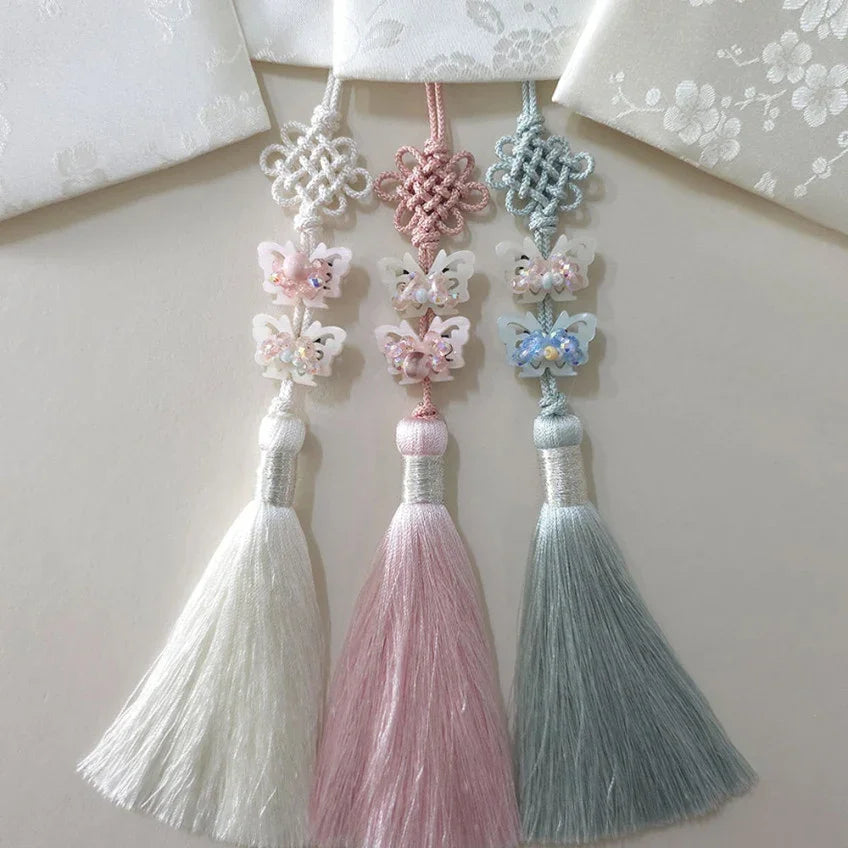 Three Crystal Butterfly Norigae in white, pink, and light blue by Native Korean.