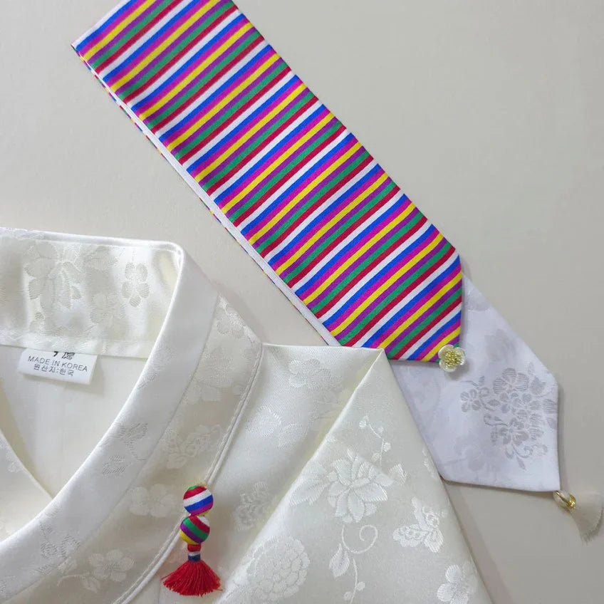White Native Korean hanbok with a colorful saekdong daenggi hair tie and norigae tassel.