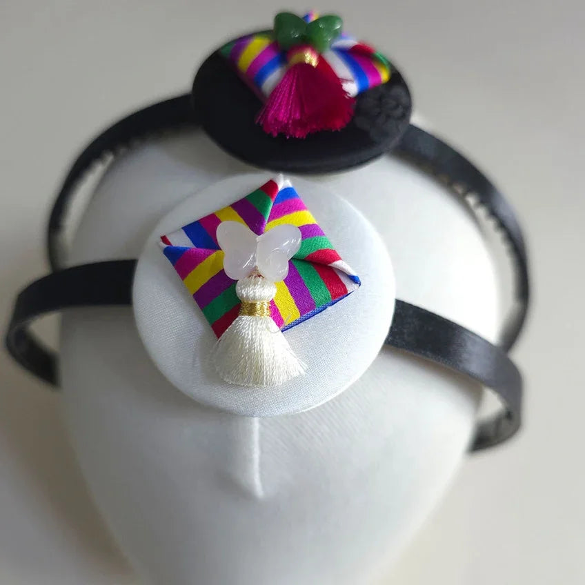 Native Korean Saekdong Ddakji Headband featuring traditional multi-colored fabric accents.