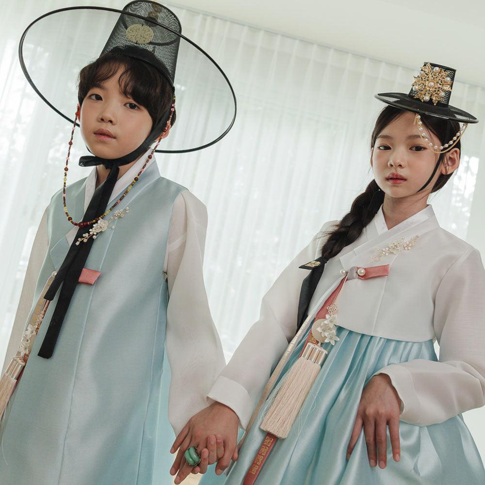 Two children wearing Native Korean sky blue boy and girl hanbok with Gat and Jokduri.