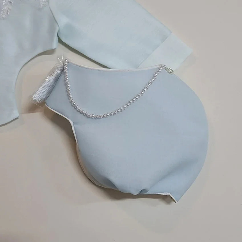 Sky blue Native Korean Jobawi with pearl accents and a white tassel.