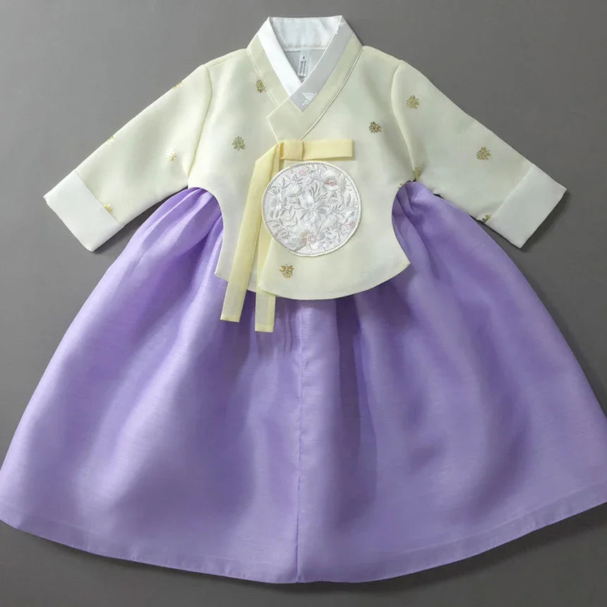 Girl Hanbok by Native Korean with a cream-colored jeogori and purple chima.