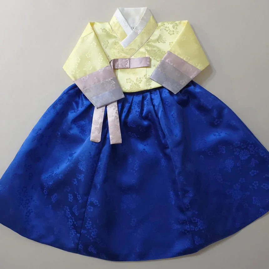 Girl Hanbok by Native Korean with a yellow jeogori and royal blue chima.