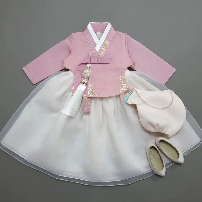 Pink and white Girl Hanbok set by Native Korean with a norigae, bag, and shoes.