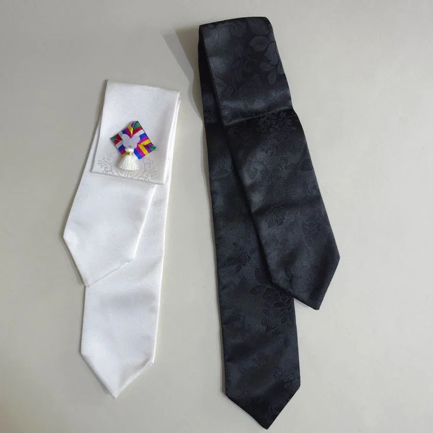 Native Korean Saekdong Ddakji hair ties in white and black.
