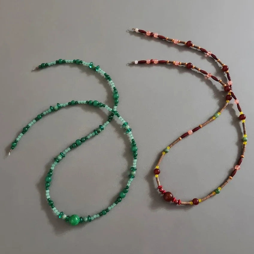 Green and reddish-brown natural stone Gat string accessories for Korean hanbok.
