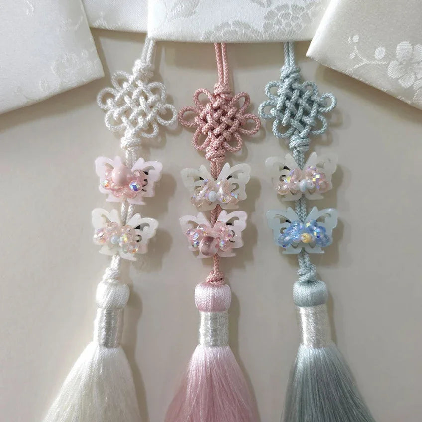 Three Native Korean Crystal Butterfly Norigae in white, pink, and light blue.