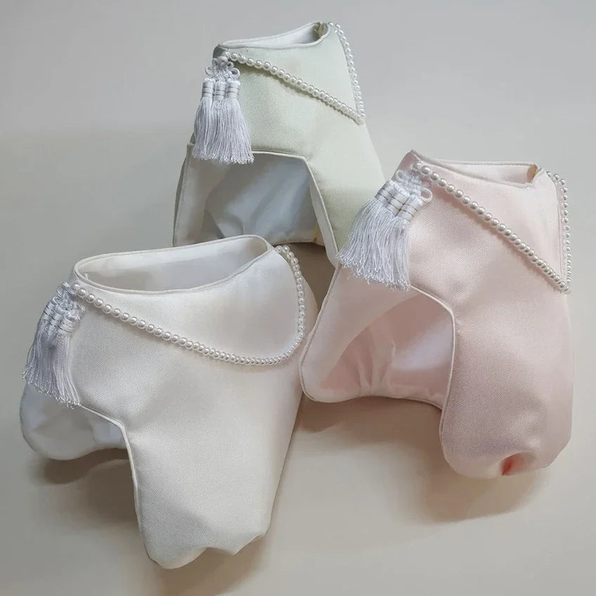 Three Mijoo Jobawi hats by Native Korean in white, pale green, and light pink with pearl beads.