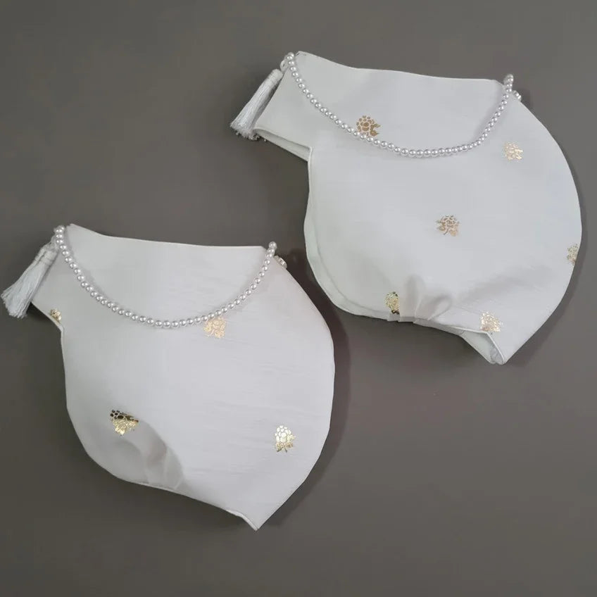 Yebon Jobawi traditional Korean girl hanbok winter hat featuring gold foil accents, a decorative front tassel, and pearl trim for Dol, Baek-il, and Korean celebrations.