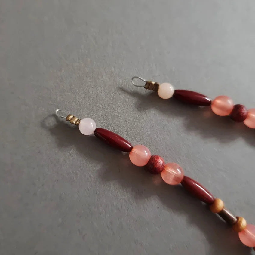 Close-up of brown and peach natural stone beads on a Native Korean Gat string.