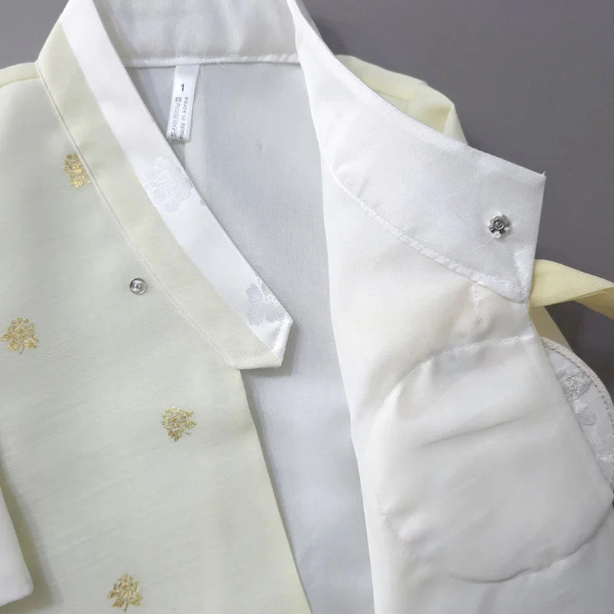 Close-up of a pale yellow Native Korean girl hanbok with gold floral embroidery