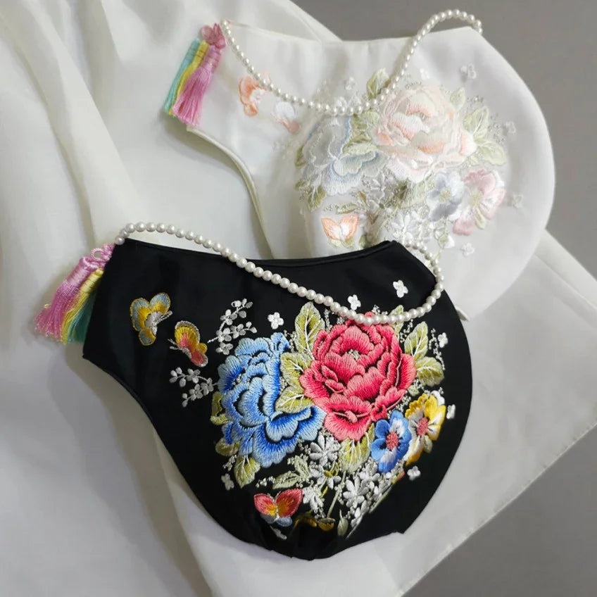 Black and white floral embroidered Jobawi by Native Korean with pearl straps and tassels.