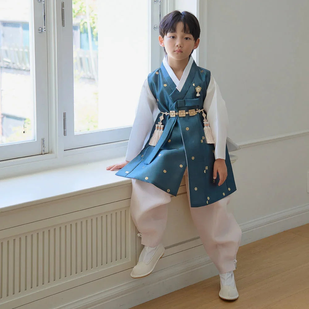 Boy wearing a Dowon teal and white Native Korean hanbok with norigae accessories.