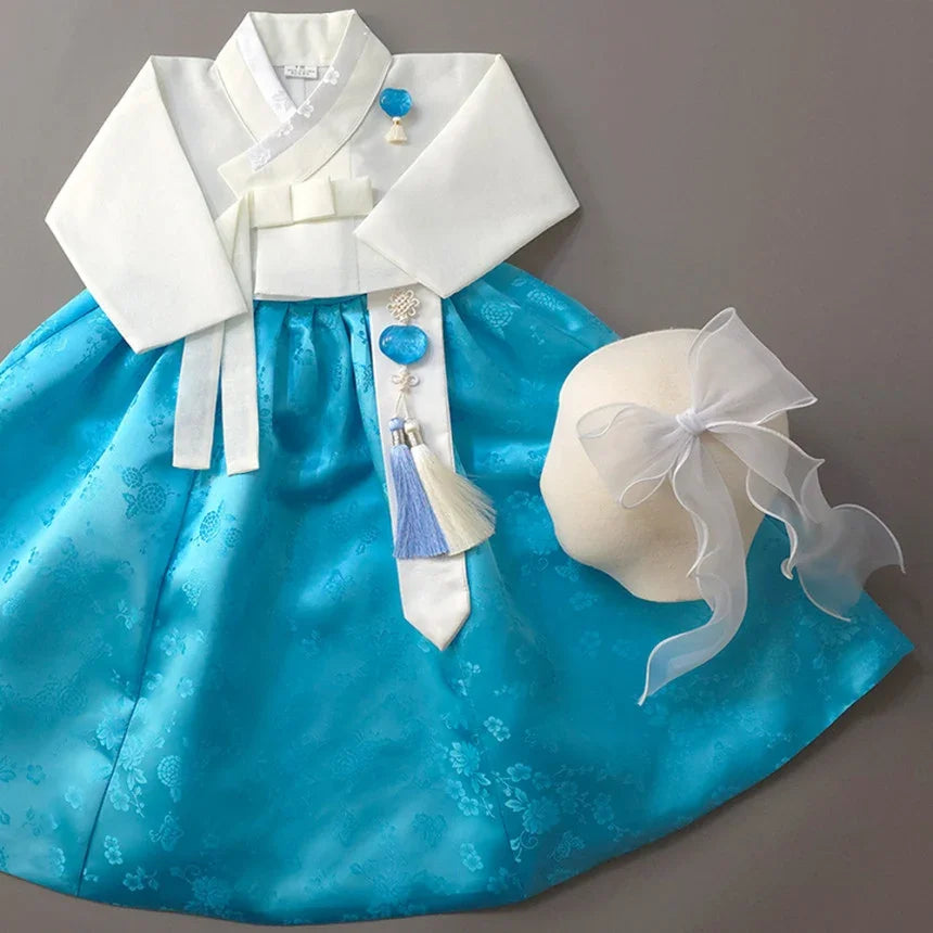 Heejin Sky Skirt Girl Hanbok by Native Korean with a white jobawi and blue norigae