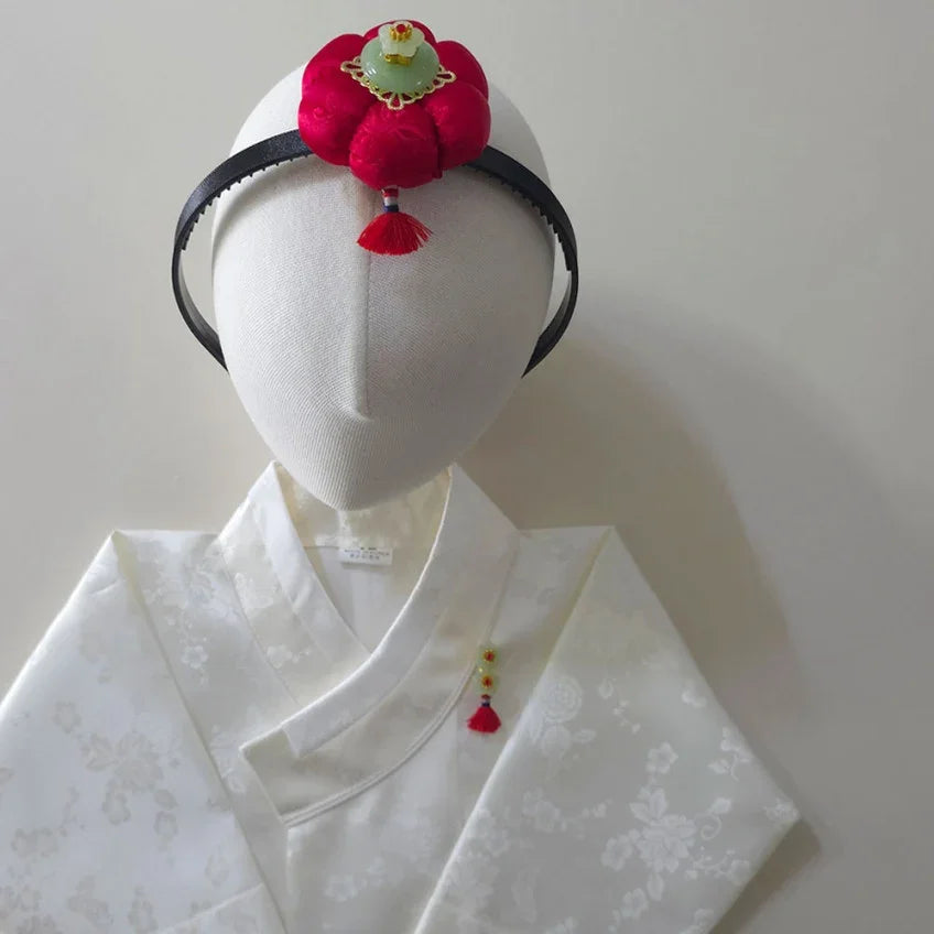 Native Korean Star Pumpkin Headband with red fabric flower and tassel on white hanbok