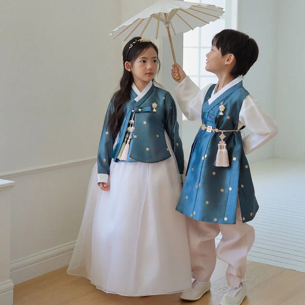 A boy and girl wearing teal Native Korean hanbok with norigae accessories.