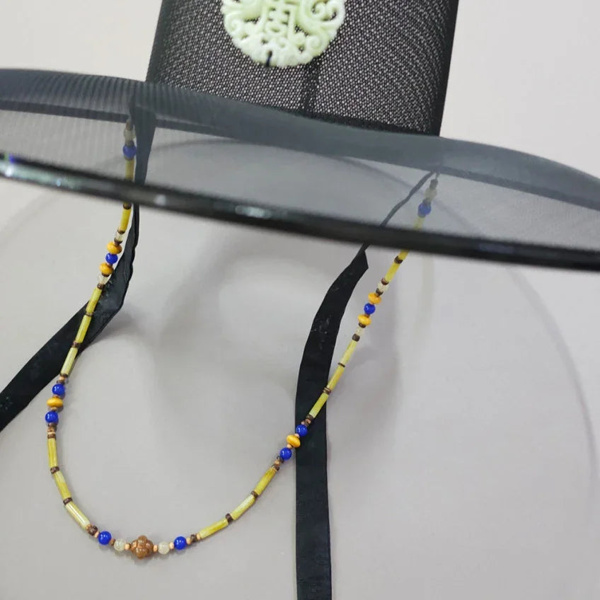Close-up of yellow natural stone Gat string from Native Korean