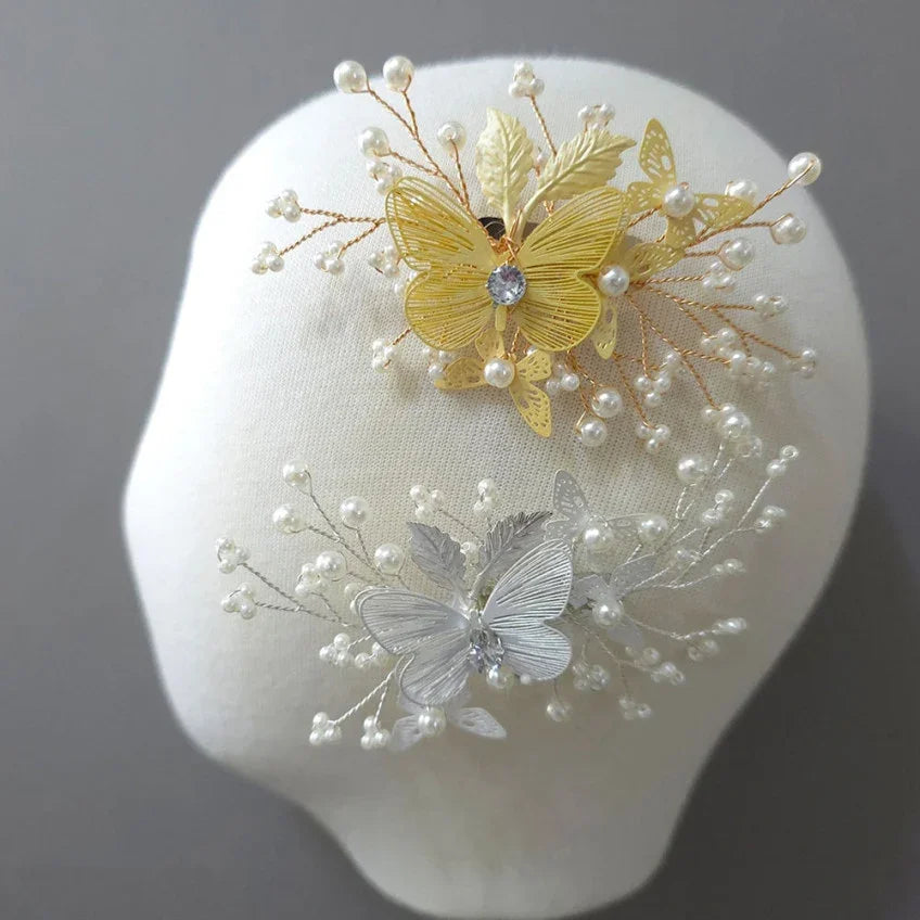 Gold and silver Native Korean Sana Butterfly Hairpins with pearls and crystals on a white mannequin.