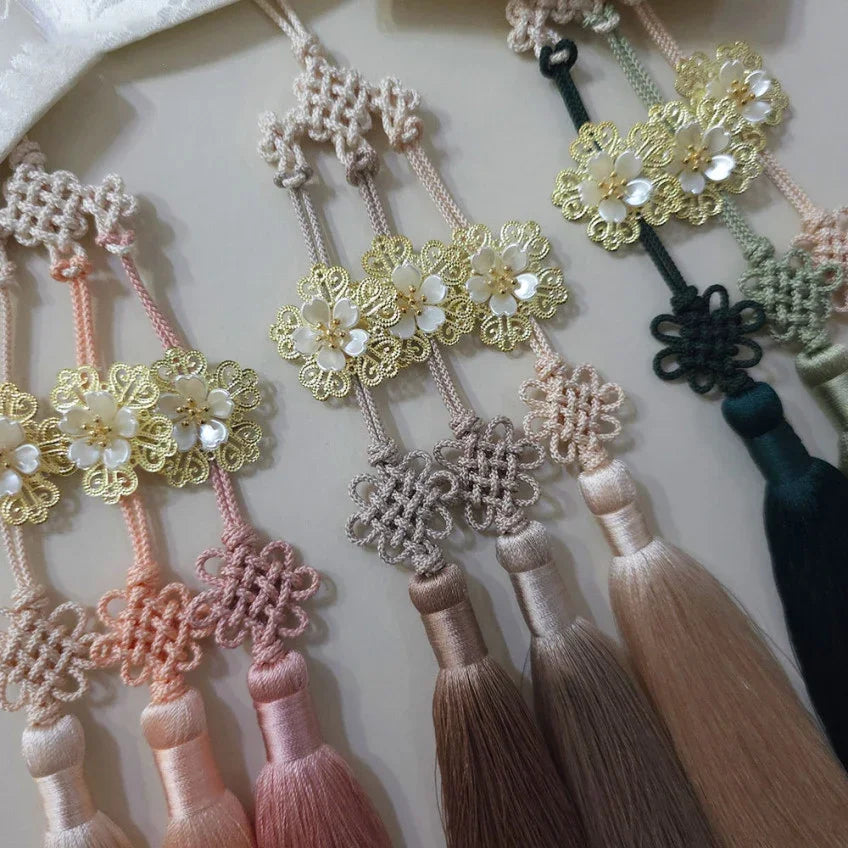 Three Bloom Trio Tassel Norigae by Native Korean in pink, beige, and green colors.