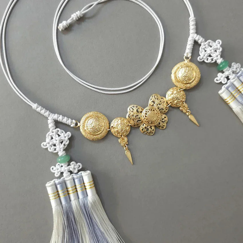 Native Korean gold medal tassel Norigae belt with intricate knots and silver tassels