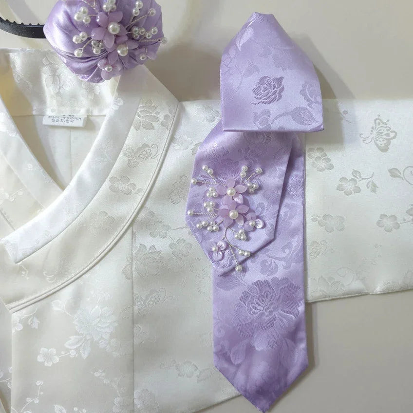 Lavender floral Daenggi and matching hair accessory on a white Native Korean hanbok.