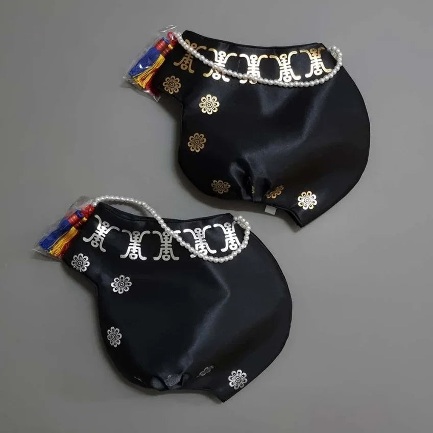 Two black Royal Foil Jobawi from Native Korean with gold flower patterns and white pearl trim.
