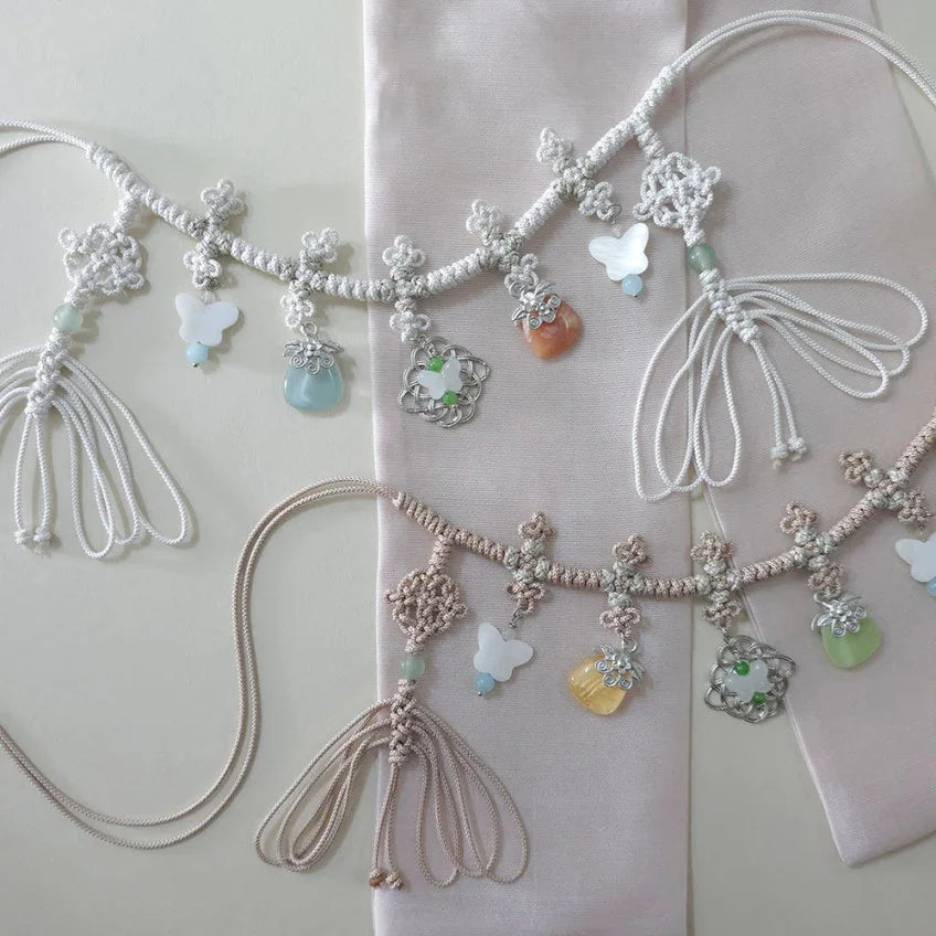 Two Native Korean Charm Knotted Dol Belts with colorful norigae charms and tassels.