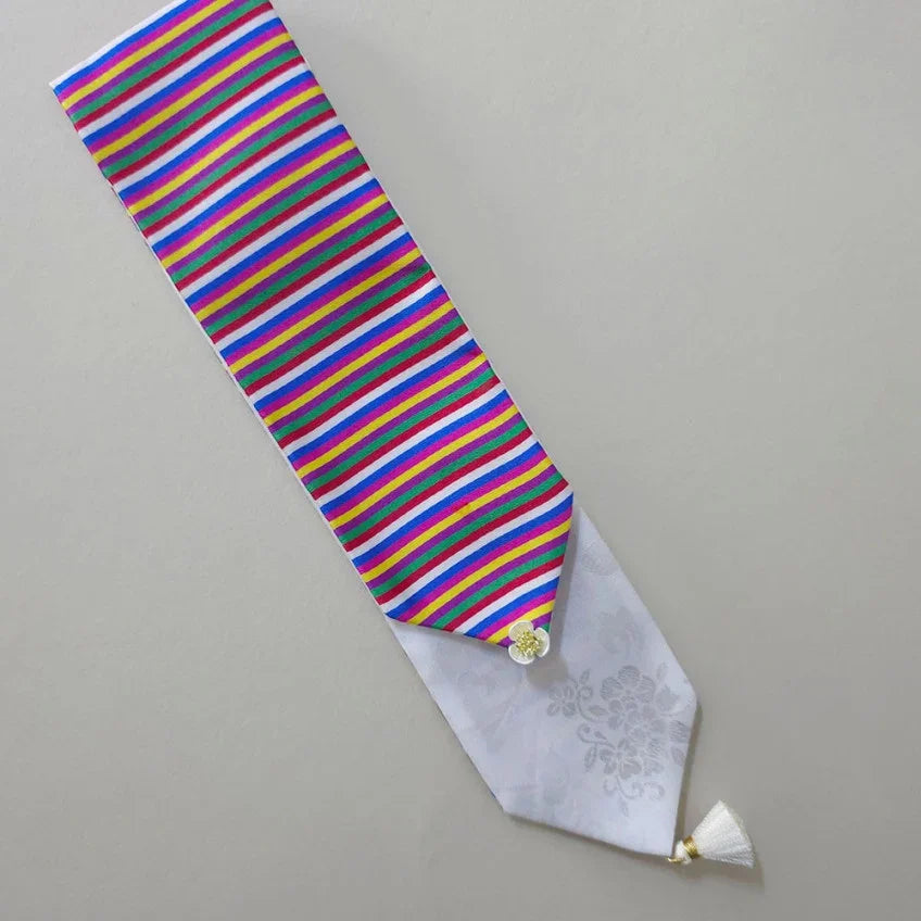 Native Korean white Saekdong Daenggi hair tie with colorful stripes and a white tassel