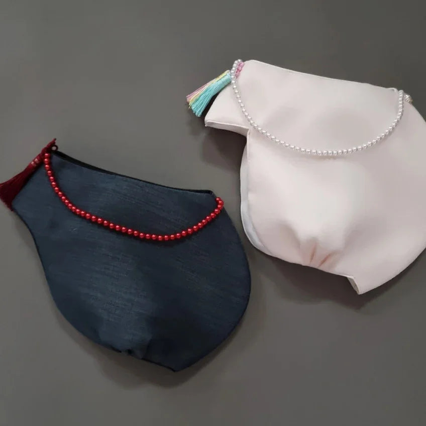 Two Yoon Jobawi by Native Korean, one in navy blue and one in light pink.