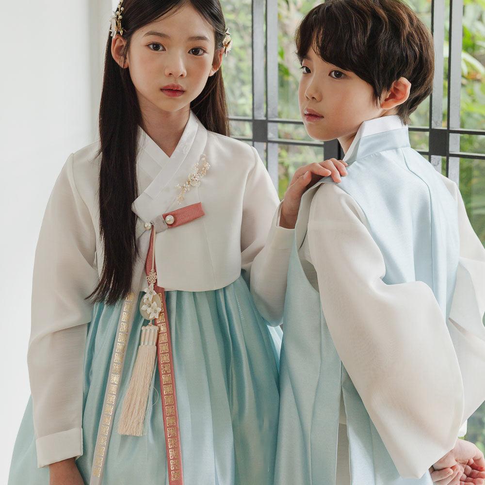 Two children wearing Native Korean Eunkyo Sky Girl Hanbok and a matching Boy Hanbok.