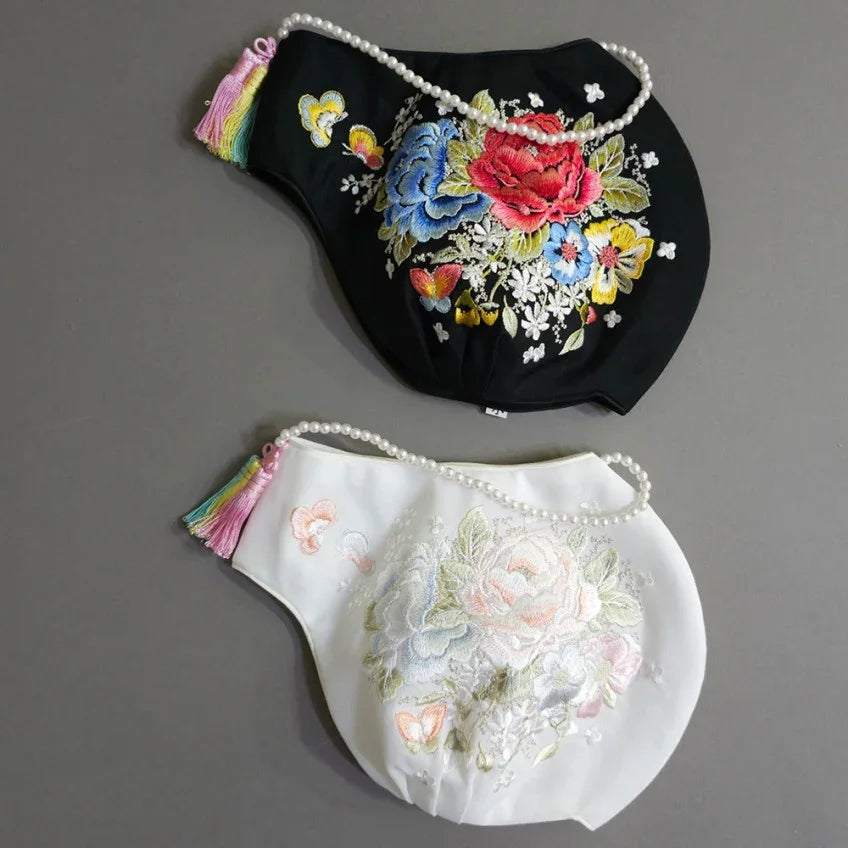 Black and white Native Korean Jobawi featuring colorful floral embroidery and pearl accents.