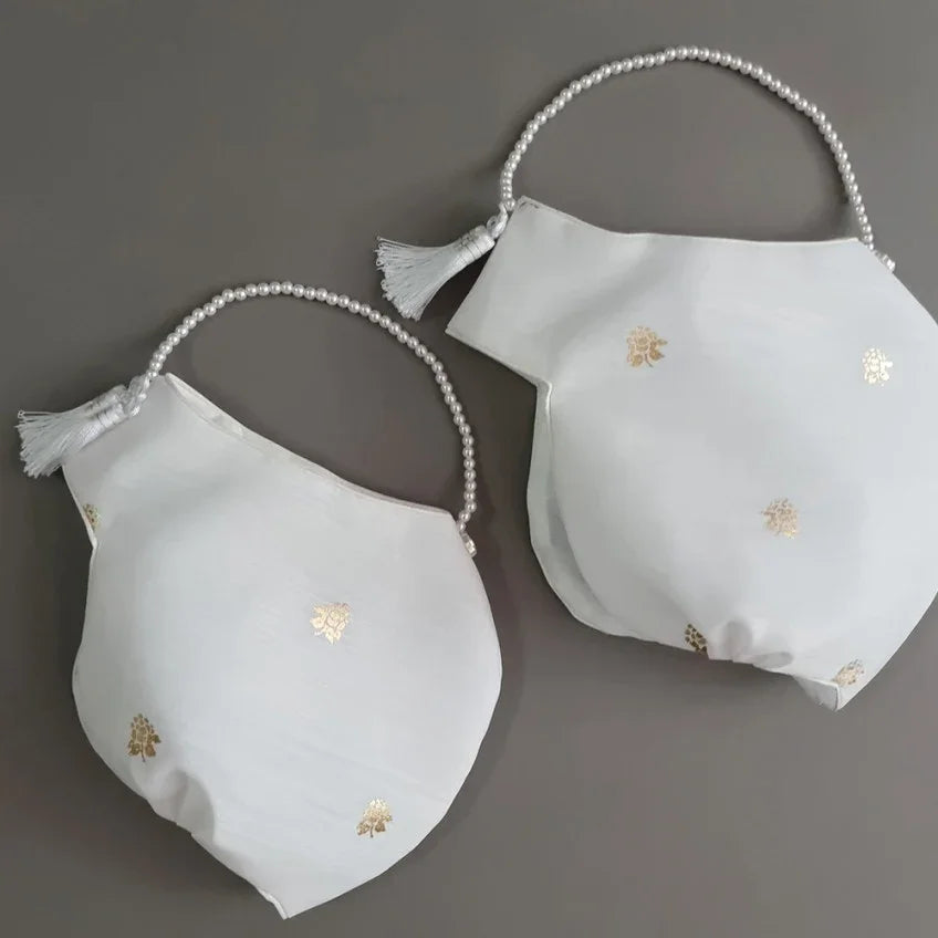 Two white Native Korean Yebon Jobawi traditional hats with gold floral patterns and pearl straps.