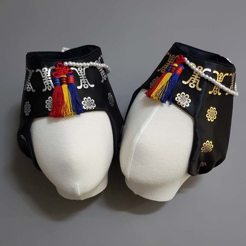 Royal Foil Jobawi traditional Korean girl hanbok hat featuring gold and silver foil patterns, pearl trim, and decorative tassels in black and white for Dol, Baek-il, and Korean celebrations.