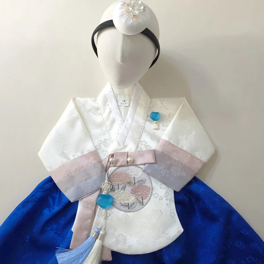Native Korean girl hanbok in white and royal blue with a Jokduri and Norigae