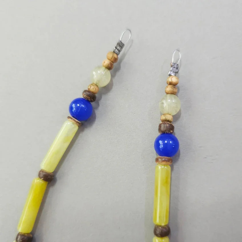 Close-up of Native Korean Natural Stone Gat String in yellow and blue beads.