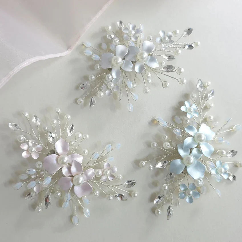 Three Native Korean botanical Hanbok hairpins with floral accents and pearls in white, pink, and blue.