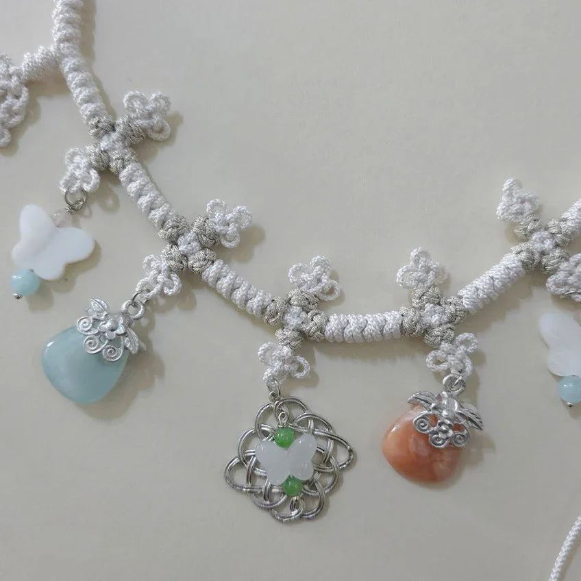 Close-up of a Native Korean Charm Knotted Dol Belt with traditional knots and gemstone charms.