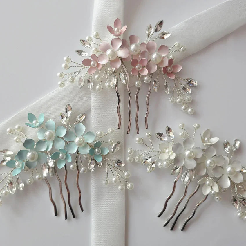 Set of floral hair combs with pearls and crystals on a white background
