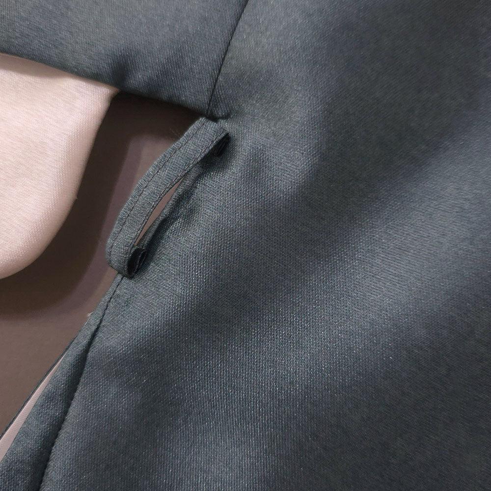 Close-up of the teal fabric and button detail of a Native Korean Boy Hanbok Dopo.