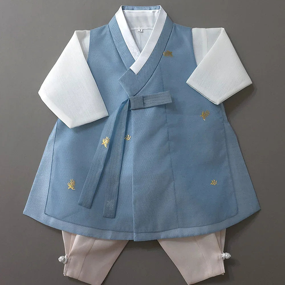 Heesung Sky Boy Hanbok by Native Korean featuring a light blue vest and white sleeves.