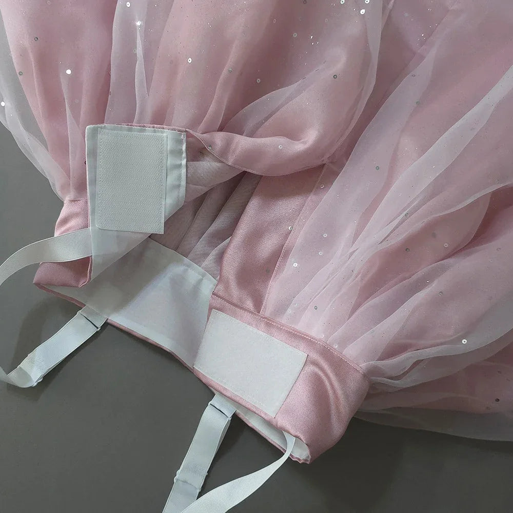 Close-up of the adjustable waistband and tulle layers of a Native Korean Pearl Sky Pink Girl Hanbok.