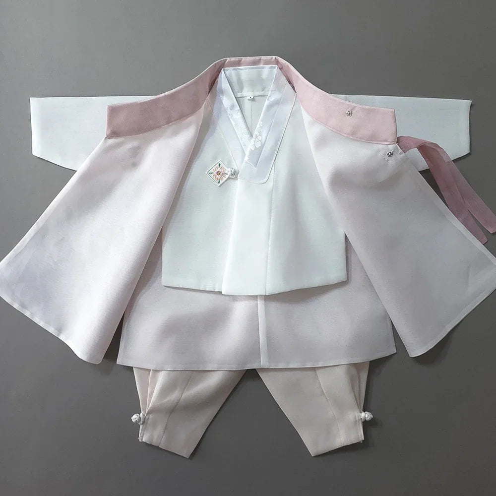 Heesung Pink Boy Hanbok by Native Korean with light pink outer jacket and white inner vest.
